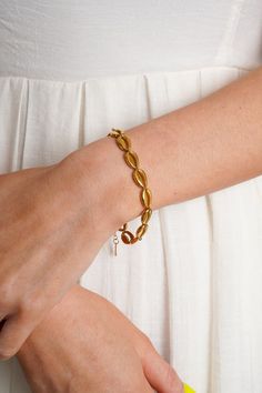 Our Seabreeze Bracelet is the ultimate summer accessory. This gold cowrie shell chain necklace is 16" long with a 2" extender. Pair it with our Seabreeze Necklace for the perfect beachy look. Lightweight and nickel and lead compliant. Gold Shell-shaped Bracelet For Vacation, Gold Bracelet With Adjustable Chain For Beach, Nickel-free Bracelets For Beach, Gold Bracelets With Lobster Clasp For Vacation, Beach Jewelry With Gold Cowrie Shell, Gold Bracelet With Lobster Clasp For Vacation, Gold Cowrie Shell Jewelry For The Beach, Gold Brass Bracelets For The Beach, Gold Brass Bracelet For The Beach