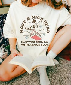 Have a nice read!  There's nothing like a rainy day with a good book! Enjoy it even more with a favorite retro bookish tee! Printed on a Comfort Colors® unisex tshirt, this new favorite is sure to be a conversation starter with other book lovers.  This would also make a fun book club shirt! Comfort Colors® is a trademark owned by Gildan Activewear SRL. * Q U I C K * F A C T S * ✺ 100% ring-spun cotton ✺ Garment dyed,  Soft Washed ✺ Medium fabric (6.1 oz/yd² (206.8 g/m ✺ Relaxed fit- Size Up for Rainy Aesthetic, Book Club Shirt, Reading Shirts, Bookish Things, Retro Mode, Retro Humor, Book Shirts, Club Shirts, Read Book