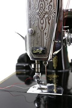 an old sewing machine is being worked on