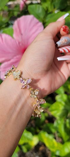 Make a statement with this beautiful bracelet! 🦋💫 18K Gold Plated Bracelet Features CZ Rhinestones Full bracelet length 8.5" Pretty Butterfly Bracelet, Pink Butterfly Bracelet, Elegant Pink Flower-shaped Bracelet, Bohemian Butterfly Bracelet, Adjustable Hand-strung Pink Crystal Bracelet, Butterfly Bracelet, Gold Plated Bracelets, Gold Butterfly, Pink Butterfly