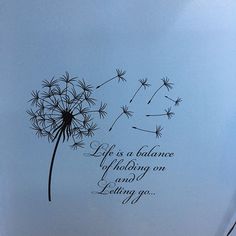 a dandelion with the words life is a balance of looking on loving you