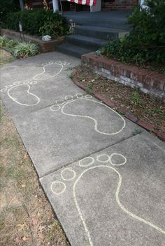 the sidewalk has been decorated with chalk drawings