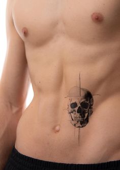 a man with a skull tattoo on his stomach