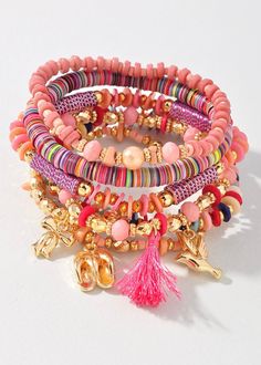 Add a touch of whimsy to your accessory game with our Beaded Charm & Shell Bracelet Set. Each bracelet features a unique assortment of colorful beads and charming puka shells. Perfect for those who like to mix and match for a playful and fun look. Pink Heishi Beads Friendship Bracelets For Vacation, Bohemian Pink Beaded Bracelets For Vacation, Whimsical Pink Bracelets With Colorful Beads, Adjustable Beaded Bracelets With Charms For Beach, Pink Heishi Beads Bracelets For Vacation, Bohemian Multicolor Charm Bracelet For Friendship, Multicolor Bohemian Charm Bracelet For Friendship, Pink Heishi Beads Vacation Bracelets, Bohemian Beach Bracelets With Charms