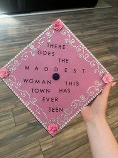 a pink graduation cap that says, there goes the maddest woman this town has ever seen