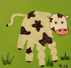 a child's drawing of a cow in the grass