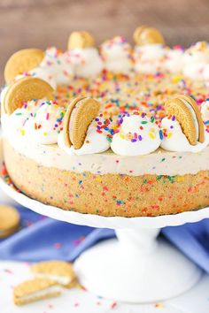 an oreo cookie cake with white frosting and sprinkles on top