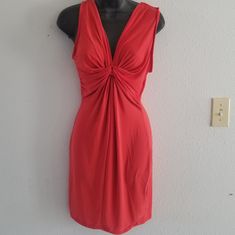 95% Poly, 5% Spandex Knit Fabric V-Neckline Sleeveless Front Tie Twist Design Stretch Fit Color: Orange/Red Fitted Sleeveless Knee-length Orange Dress, Free Size Orange V-neck Dress, Vibrant Orange V-neck Dress, Basic Dresses, Orange Rayon V-neck Dress, Basic Dress, Orange Red, Color Orange, Sleeveless Dress