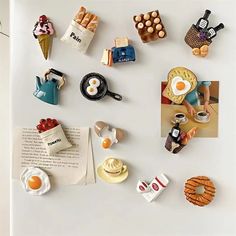 there are many magnets on the fridge to display food and drink related items,