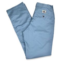 For our Work Uniform chinos we are using a new Japanese trademarked fabric called Solotex. A spring-like, helical molecular structure provides form stability to spring back into shape even with movement. The fiber resist wrinkles and does not easily get stretched out from repeated bending at the knee, maintaining its original shape. This 9 oz twill consist of 58% cotton and 42% polyester with a light mechanical 4 way stretch that comes from they way it’s weaved, no Lycra. This material is super Classic Washed Blue Cotton Bottoms, Blue Cotton Pants With Straight Hem, Blue Straight Hem Chinos For Work, Classic Blue Cotton Chinos, Fitted Chino Cotton Twill Chinos For Spring, Blue Chinos With Straight Hem For Work, Blue Cotton Chinos For Work, Blue Cotton Tapered Leg Work Pants, Blue Cotton Work Pants With Pockets