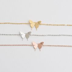 "These personalized butterfly bracelets will be perfect thank you gifts for your wedding, anniversaries, and birthdays. You can also gift these to your best friends, bridesmaids and sorority sisters! Great minimal bracelets for layering or for easy, everyday wear. D E T A I L S - Delicate Initial Butterfly charm - Butterfly Size: 13mm x 17 mm - Hand-Stamped Initial of your choice - We can stamp Uppercase letters, numbers,♡ (heart) - Available in Gold, Rhodium, or Rose gold Plated - This listing Elegant Butterfly Bracelets For Wedding, Adjustable Butterfly Charm Jewelry For Wedding, Butterfly Charm Bracelet Jewelry Gift, Adjustable Butterfly Jewelry For Wedding, Stainless Steel Butterfly Necklace Gift, Butterfly Shaped Wedding Jewelry, Silver Butterfly Bracelets For Gifts, Silver Butterfly Bracelet For Gift, Butterfly Shaped Silver Bracelet Gift