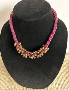 Beautiful beaded necklace with variegated purple and gold teardrop beads and violet seed beads.  (The colors are more accurate in the last photo.)  Made with hundreds of glass beads, braided using the Kumihimo method of braiding.  Dramatic!  18.5 inches long.  Locking magnetic clasp.  Free shipping in the US! Beautiful Beaded Necklaces, Santa Fe Nm, Teardrop Beads, Magnetic Clasp, Chain Styles, Santa Fe, Seed Beads, Necklace Etsy, Necklace Lengths