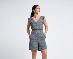 "A lightweight short summer romper feturing v-neckline, short ruffled sleeves and a shift silhouette. - V neck - short ruffled sleeves - shift silhouette - front button closure - two pockets in side seams - fabric belt - mini length (above the knee) - flower print Fiber: 100 % viscose Color: dark green For Size S (06 US): length - 34\" (87 cm) You may feel free choosing the size. Just send us your measurements (bust, waist, hips, height)." Knee Length Jumpsuit, Boho Playsuit, Cute Summer Rompers, Beach Jumpsuit, Skater Dresses Casual, Bridesmaids Jumpsuits, Overalls For Women, Evening Jumpsuit, Expensive Clothes