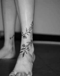 a woman's foot with a tattoo on it