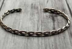 Vintage sterling silver woven infinity rope bracelet.  Nicely weighted.  It is a large to medium size (see pictures).  Sterling silver.  Unmarked although tested Presidium Duo tester.  6.38 grams Bracelet Vintage, Sterling Silber, Vintage Sterling Silver, Vintage Silver, Rope Bracelet, Medium Size, Cuff Bracelets, Silver Bracelet, Beauty Book