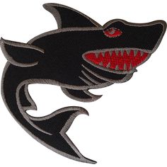 a black shark with red teeth on it's face