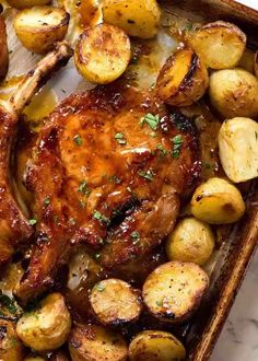 chicken and potatoes in a roasting pan