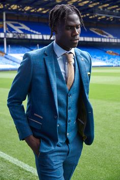 Kick off your formal wear with the Dion suit, as worn by Everton Midfielder Amadou Onana. With its soft lapis blue tone and champagne trims, it has been created with meticulous craftsmanship using a herringbone weave. Formal wear with an edge for the gent who stands out. Features Herringbone Slim fit Single-breasted Notch lapel Single back vent Four button cuff Single button blazer fastening Complimentary pocket square Waistcoat adjuster straps Functional inside and outside pockets to the blazer Bespoke Blue Blazer With Suit Collar, Bespoke Blue Three-piece Suit, Bespoke Blue Blazer With Notch Lapel, Blue Bespoke Blazer With Notch Lapel, Bespoke Blue Blazer For Work, Blue Single-breasted Tweed Jacket With Suit Collar, Bespoke Tailored Blue Suit, Tailored Blue Tweed Jacket For Business, Blue Semi-formal Tweed Jacket With Suit Collar