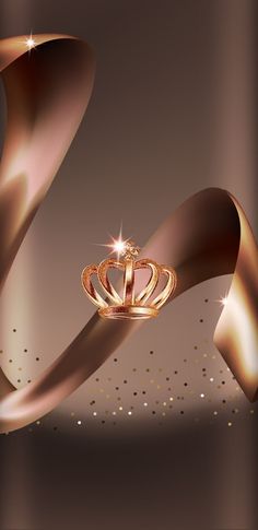 a gold crown on top of a shiny ribbon