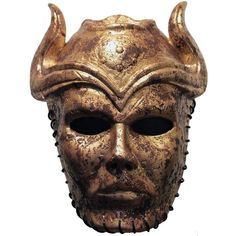 a gold mask with horns on it's head is shown in front of a white background