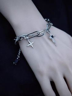 Elevate your accessory game with this unique handcrafted cross charm Gothic bracelet. Embracing the Y2K subculture aesthetic, this silver bracelet exudes a cool and edgy vibe.   Please note that this product includes only one bracelet. Gothic Jewellery Aesthetic, Edgy Silver Jewelry With Charms, Punk Cross Jewelry For Streetwear, Punk Style Silver Cross Pendant Jewelry, Edgy Metal Cross Jewelry, Edgy Cross-shaped Metal Jewelry, Silver Punk Bracelet, Grunge Cross Jewelry For Gift, Silver Metal Grunge Bracelets