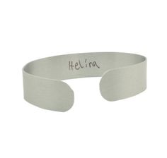 Signature cuff bracelet makes a wonderful personalized gifts for any Mom. Available in silver, gold or rose gold color choices. Writing can be on one or both sides of the bracelet. Let us design this memorable keepsake that captures your child's handwriting. Send us an image or a scan of the handwriting you would like to incorporate into this bracelet. Allow up to 5 days on custom orders. The signatures are permanently printed onto the aluminum bracelets. Lightweight and comfortable. One size fi Handwriting Signature, Handwriting Bracelet, Handwriting Gifts, Aluminum Bracelets, Signature Bracelet, Rose Gold Color, Grandma Gifts, Color Choices, Gifts For Wife