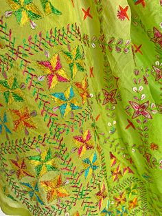 This elegant traditional Green Bridal Phulkari Dupatta is expertly crafted from Pure Chinon Silk, with Gotta Patti and phulkari hand embroidery all over. The perfect choice for weddings, sangeet, jaago, and chunni ceremonies. Material: Pure silk chinon Work: Silk thread phulkari handwork, all over gotta patti work Pattern: Floral Size: Full Size 2.5 meters Dispatched in 1-3 business days Product Note:​ This is a handcrafted product from artisans and producer groups and due to the nature of the p Embroidered Green Choli For Festivals, Pista Green Salwar Kameez With Dori Work For Festivals, Bohemian Embroidered Green Dupatta, Multicolor Silk Thread Traditional Wear For Festivals, Unstitched Yellow Salwar Kameez With Motifs, Traditional Resham Embroidery Wear For Festivals, Multicolor Silk Traditional Wear For Festivals, Traditional Wear With Resham Embroidery For Festival, Traditional Festival Wear With Resham Embroidery