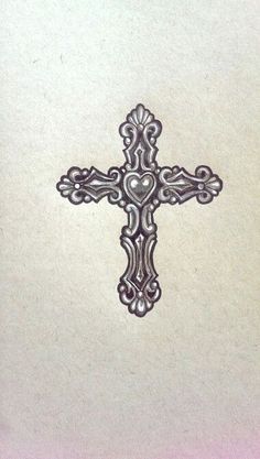 the cross is made up of intricate designs on white paper with pink and blue background