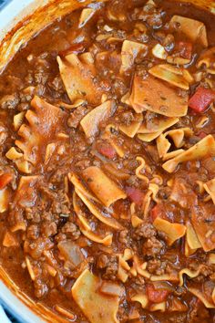 a large pot filled with pasta and meat