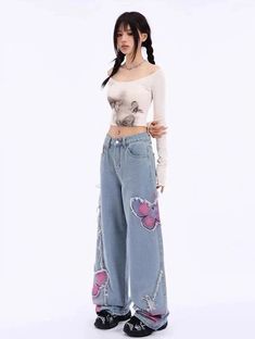 Rock these Distressed Pink Butterfly Jeans 🦋 and make a statement with their unique distressed design. These cute and pretty jeans feature edgy pink butterfly designs that will surely turn heads. Be bold and playful with your fashion choice! Size Chart: Size Waist (cm) Hip (cm) Length (cm) Waist (in) Hip (in) Length (in) S 63 94 100 24.80 37.01 39.37 M 67 98 101 26.38 38.58 39.76 L 71 102 102 27.95 40.16 40.16 XL 75 106 103 29.53 41.73 40.55 Description: Item Type: JeansJeans Style: High Waist Punk Wide Leg Jeans For Spring, Wide Leg Punk Jeans For Spring, Pink Distressed Summer Jeans, Summer Distressed Pink Jeans, Pink Distressed Jeans For Summer, Summer Pink Distressed Jeans, Edgy Blue Bottoms For Spring, Trendy Ripped Pink Bottoms, Trendy Ripped Pink Jeans