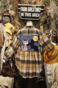 a mannequin wearing a plaid shirt and hat with the words farm girls only in this area on it