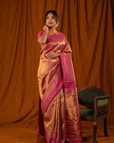 Featuring the stunning gold and Rani pink Tissue and Silk 8 Kol or Ettu Kol Kanjivaram silk saree, with gold tissue plain body and Rani pink seepu rekku border and opulent rich pallu. The craftsmanship of this saree lies in its meticulous weave, where zari and silk are woven together using a distinctive technique that highlights the seamless interplay between the silk and zari. Saree code: CL8K3139 #cliosilks #indianhandloom #weavesoftamilnadu #silksarees #iwearhandloom #kanchipattu #saree...