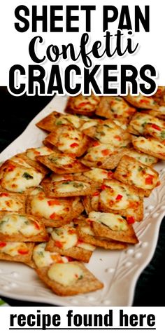 a plate full of crackers with the words sheet pan confetti crackers