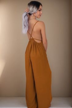 Olivia Mark - Loose Fit Sleeveless Jumpsuit with Wide Leg Pants for Casual Wear Casual Strapless Backless Jumpsuit For Spring, Summer Strapless Sleeveless Jumpsuit For Loungewear, Sleeveless Brown Jumpsuits And Rompers For Summer, Brown Sleeveless Summer Jumpsuits And Rompers, Brown Sleeveless Summer Jumpsuit, Spring Backless Jumpsuits And Rompers For Loungewear, Brown Summer Jumpsuits And Rompers For Loungewear, Summer Brown Jumpsuits And Rompers For Loungewear, Fitted Jumpsuit