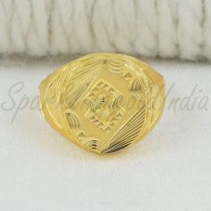 Inspired by the timeless beauty of traditional Indian artistry, this 22k gold ring embodies grace and sophistication. Handcrafted with intricate detailing, the design showcases a blend of classic motifs and contemporary flair. Perfect for marking special occasions or adding a touch of luxury to your everyday look, this ring celebrates the richness of Indian heritage with every gleaming curve. 22k gold ring handmade jewelry made in India Metal is Real Gold Not Filled or Not Gold Plated Metal - Ye Gold Temple Jewelry Rings For Anniversary, Traditional Handmade Signet Ring For Ceremonial Use, Traditional Hallmarked Signet Ring As Gift, Traditional Handmade Gold Signet Ring, Traditional Engraved Yellow Gold Ring, Traditional Engraved Signet Ring For Formal Occasions, Traditional Handmade Wedding Signet Ring, Traditional Hallmarked Engraved Ceremonial Ring, 22k Gold Engraved Rings For Ceremonial Occasions