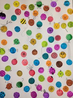 an art project for kids with different colored bugs and ladybugs on it,