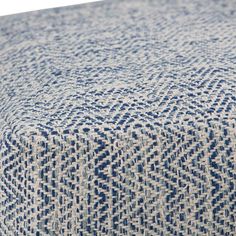 a blue and white patterned ottoman cover