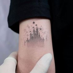 a person with a small tattoo on their arm