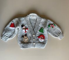 a knitted sweater with christmas decorations on it