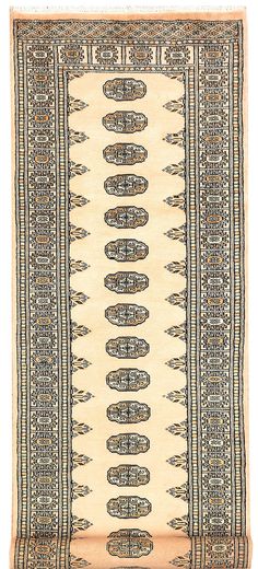 an old rug with many different designs on the bottom, and one in beige color