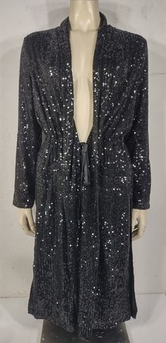 ladies beautiful sequin-embellished duster cardigan BB Dakota by Steve Madden brand black Brand new with tags! no flaws or signs of wear to speak of. MSRP $139.00. Would make a great gift! size XS (please refer to measurements below) Shell: 95% polyester, 5% spandex; Lining: 100% polyester Measurements lying flat: Bust: 21.5 inches. Length (from shoulder to bottom hem): 42 inches.  Policies and Disclosures: RETURNS: Returns are accepted within 30 days of purchase. Buyer is responsible for return Plus Size Sequin Duster, Black Long Sleeve Outerwear With Rhinestone Rivets, Bb Dakota Sequin Duster, Glamorous Sequin Winter Cardigan, Sequin Duster, Black Long-sleeved Studded Outerwear, Brooklyn And Bailey, Duster Cardigan, Bb Dakota