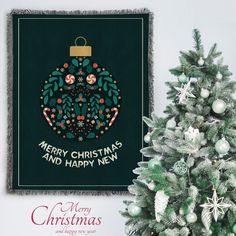 a christmas ornament hanging on the wall next to a tree with ornaments around it