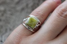 This one of a kind Scottish Green Marble ring has been handmade of 925 Sterling Silver in our workshop. Please select the size and you will receive exactly the same ring as presented in the photos of the listing. Scottish Green Marble was formed over 600 million years ago when molten volcanic rock pushed up from deep inside the earth through the overlying limestone. The area these stones are found is one of the most remote parts in the Highlands and Islands. In Scotland this beautiful stone has been highly revered since prehistoric times. Local people carried small pieces for protection. This stone can help you draw pain from the body and it provides the wearer with a new self-confidence. The stone connects to the spiritual vibration and energy of Scotland. Sterling Silver Gemstone Rings With Nature-inspired Style, Elegant Untreated Open Ring Jewelry, Unique Untreated Ring Jewelry, Artisan Sterling Silver Ring With Polished Finish, Artisan Sterling Silver Open Ring Jewelry, Untreated Sterling Silver Rings - Fine Jewelry, Untreated Green Sterling Silver Ring, Untreated Open Ring Jewelry For Anniversary, Handmade Green Sterling Silver Ring