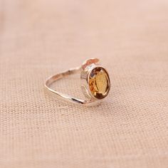 Gemstone - Citrine Gemstone Size - 10x08 oval Metal - Sterling Silver Citrine attracts wealth and helps you to overcome negative emotions, citrine also knows as the stone of success. To change the ring size i request the buyer to pull the band lock in the opposite direction. This Fabulous ring is made by granulation technique by soldering each ball precisely and wrapping the silver wire around the collet manually. The ring can be customized on request and gemstone can be switched to any gemstone Citrine Silver Ring, Oval Citrine Birthstone Jewelry, Oval Citrine Birthstone Ring For Anniversary, Oval Faceted Crystal Promise Ring, Oval Faceted Birthstone Ring For Anniversary, Amber Birthstone Ring, Topaz Crystal Open Ring Gift, Faceted Oval Topaz Ring Gift, Oval Citrine Promise Ring