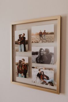 a wooden frame with photos hanging on the wall