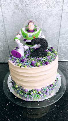 there is a cake that looks like the buzz lightyear from toy story on it