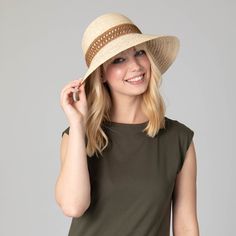 Stay protected from the sun in style with this Waterfront Raffia Braided Bucket Sun Hat. The 100% raffia material ensures a lightweight and breathable experience, while the 3" brim offers ample coverage. The woven jacquard band and natural color give it a classic, yet stylish look. Feel confident wearing this 57cm hat with any summer outfit. Features: Color: NaturalMaterial: 100% RaffiaBrim Size: 3"Size: 57cm Lightweight Wide Brim Hat For The Beach, Lightweight Wide Brim Hat For Beach, Lightweight Natural Straw Hat For Day Out, Lightweight Paper Straw Hat For Spring, Lightweight Wide Brim Straw Hat For Beach, Spring Straw Sun Hat Upf 50+, Spring Straw Sun Hat With Upf 50+, Lightweight Wide Brim Hat For Warm Weather, Lightweight Spring Vacation Hat