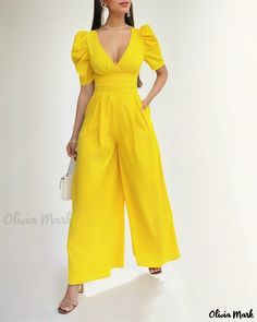 Olivia Mark - Wide Leg Jumpsuit with Puffed Sleeves and Plunge Neckline Fitted Solid Color Jumpsuits And Rompers With Puff Sleeves, V-neck Solid Color Jumpsuits And Rompers For Spring, Solid Color V-neck Jumpsuits And Rompers For Spring, Fitted Puff Sleeve Jumpsuits And Rompers For Summer, Spring High-waist Jumpsuits And Rompers, Chic Puff Sleeve Jumpsuits And Rompers For Party, Yellow Jumpsuit For Party, Summer Puff Sleeve Jumpsuits And Rompers For Brunch, Workwear Puff Sleeve Jumpsuits And Rompers For Spring