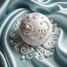 an intricate white object on a blue satin