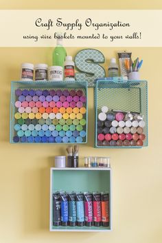 craft supply organization using wire baskets mounted to your wall